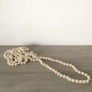Extra long faux pearl necklace